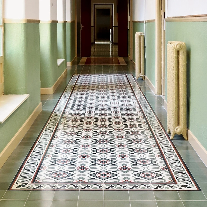 Hallway with cement tile flooring in green and white pastel colours